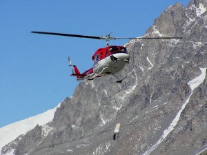 A helicopter with a sling load in Antarctica.