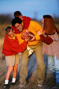 Family Playing Football